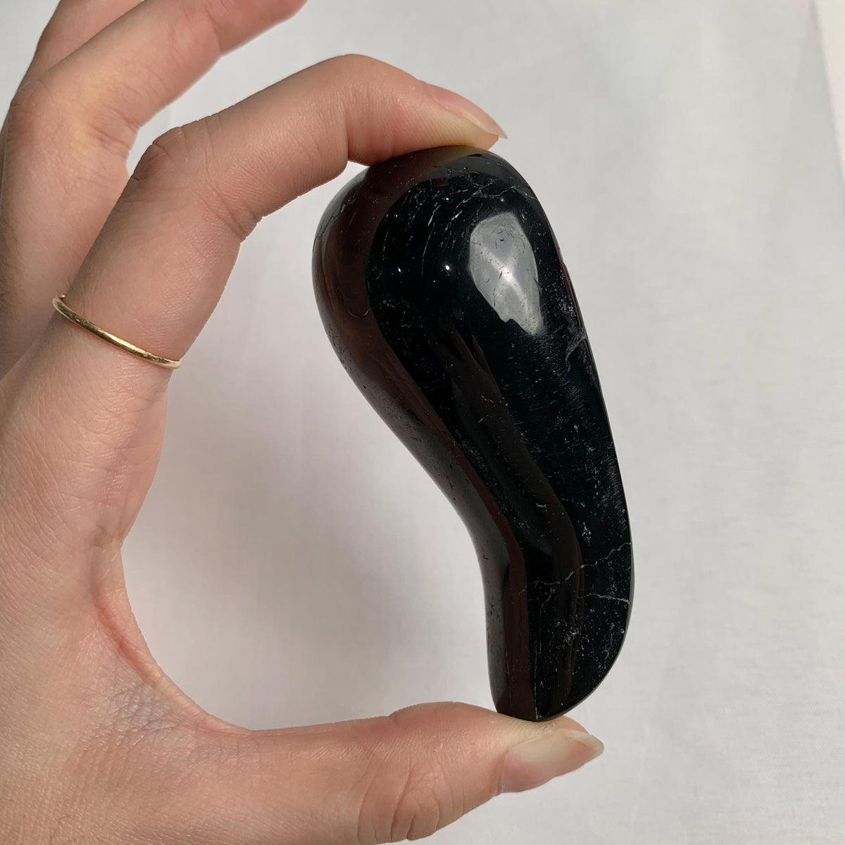 Polished black tourmaline crystal tool