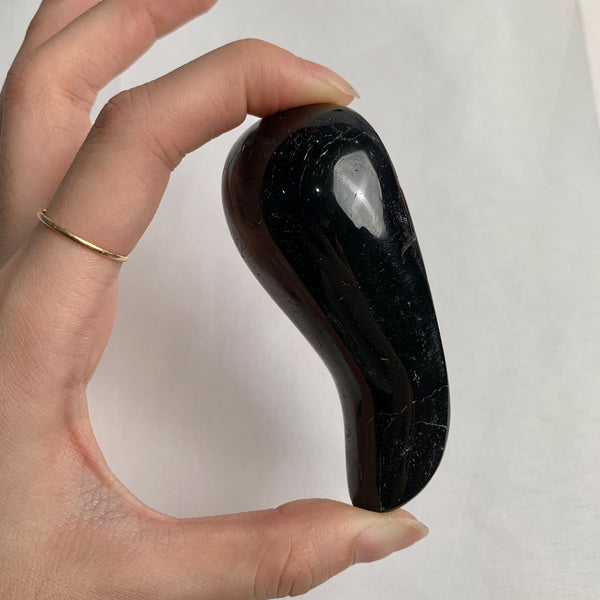 Polished black tourmaline crystal tool