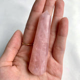 Polished rose quartz crystal point