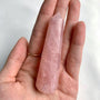 Polished rose quartz crystal point