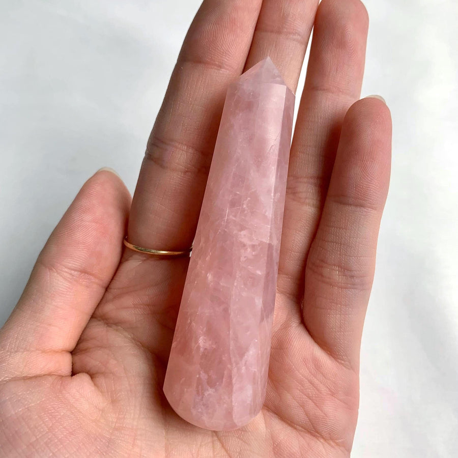 Polished rose quartz crystal point