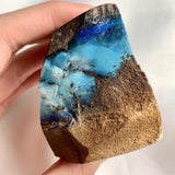 Boulder opal display piece showing colorful opal veins