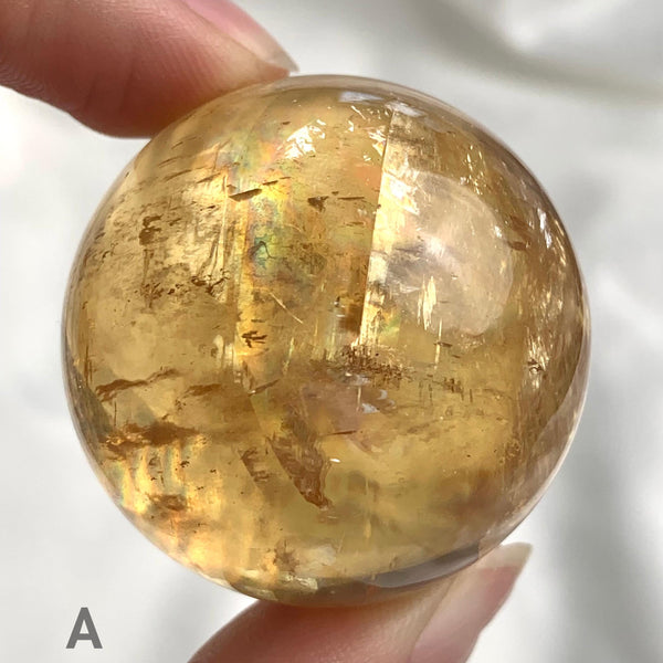 Natural honey calcite sphere closeup
