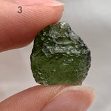 Natural untreated Moldavite crystal with detailed surface patterns