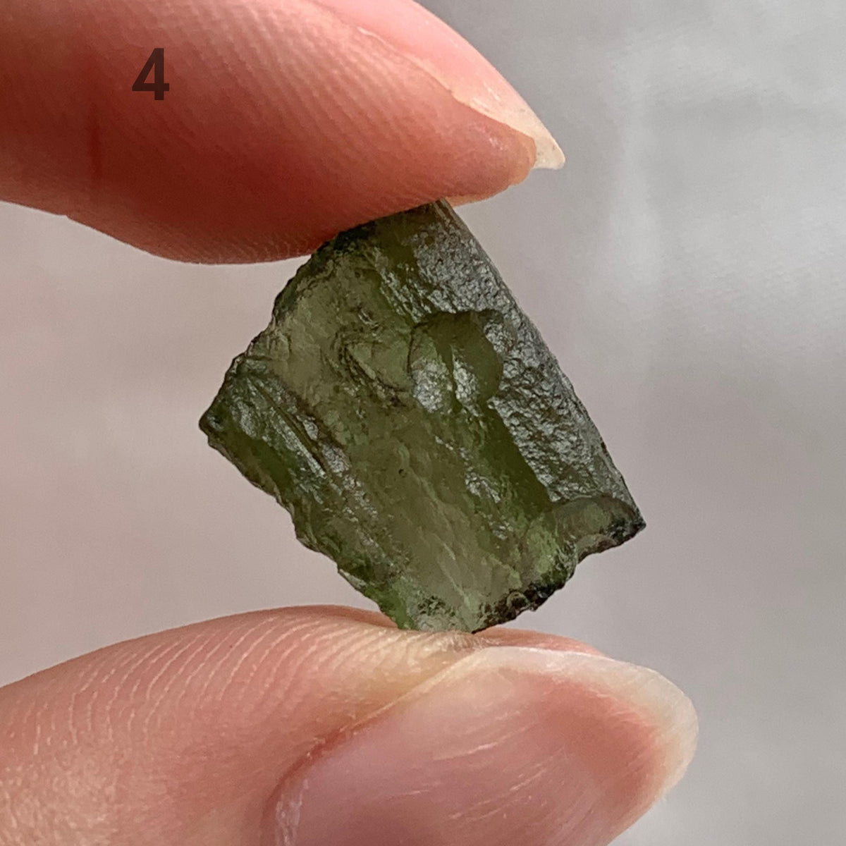 Natural Moldavite crystal formed by ancient meteorite impact