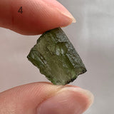 Natural Moldavite crystal formed by ancient meteorite impact