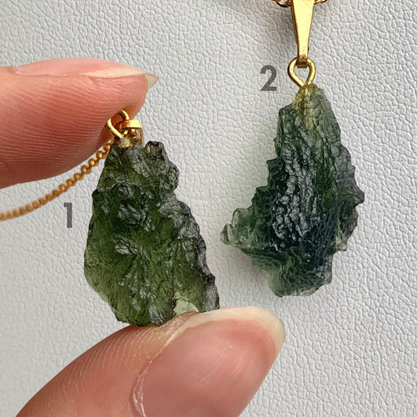 Natural Czech moldavite pendant with raw texture and form