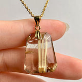 AAAA Rutilated Quartz pendant with golden needle inclusions on gold vermeil chain