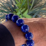 Super high quality lapis bracelet with large 14mm polished blue beads.