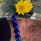 Bold blue gemstone bracelet with polished 14mm lapis beads for everyday wear.