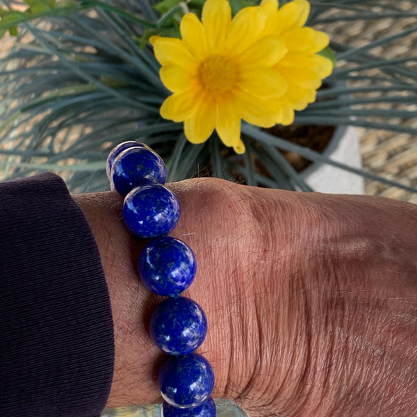 Bold blue gemstone bracelet with polished 14mm lapis beads for everyday wear.