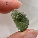 Genuine Moldavite crystal photographed on white background