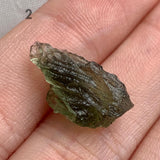Rare Moldavite specimen showing natural texture and translucency