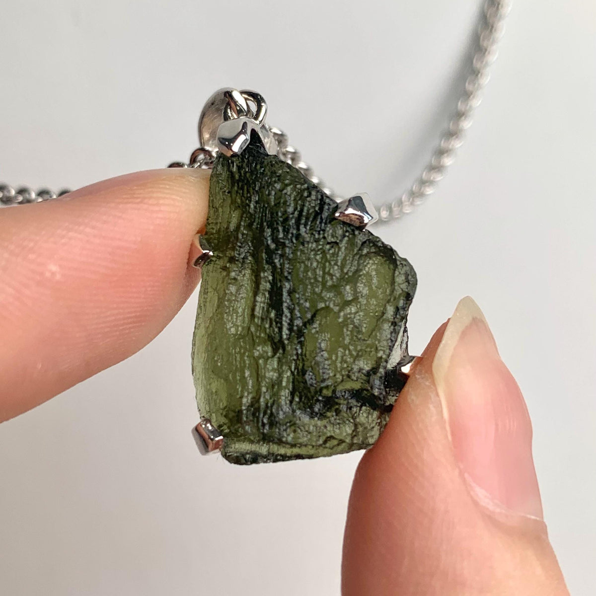 Raw authentic moldavite necklace on silver chain from Czech Republic
