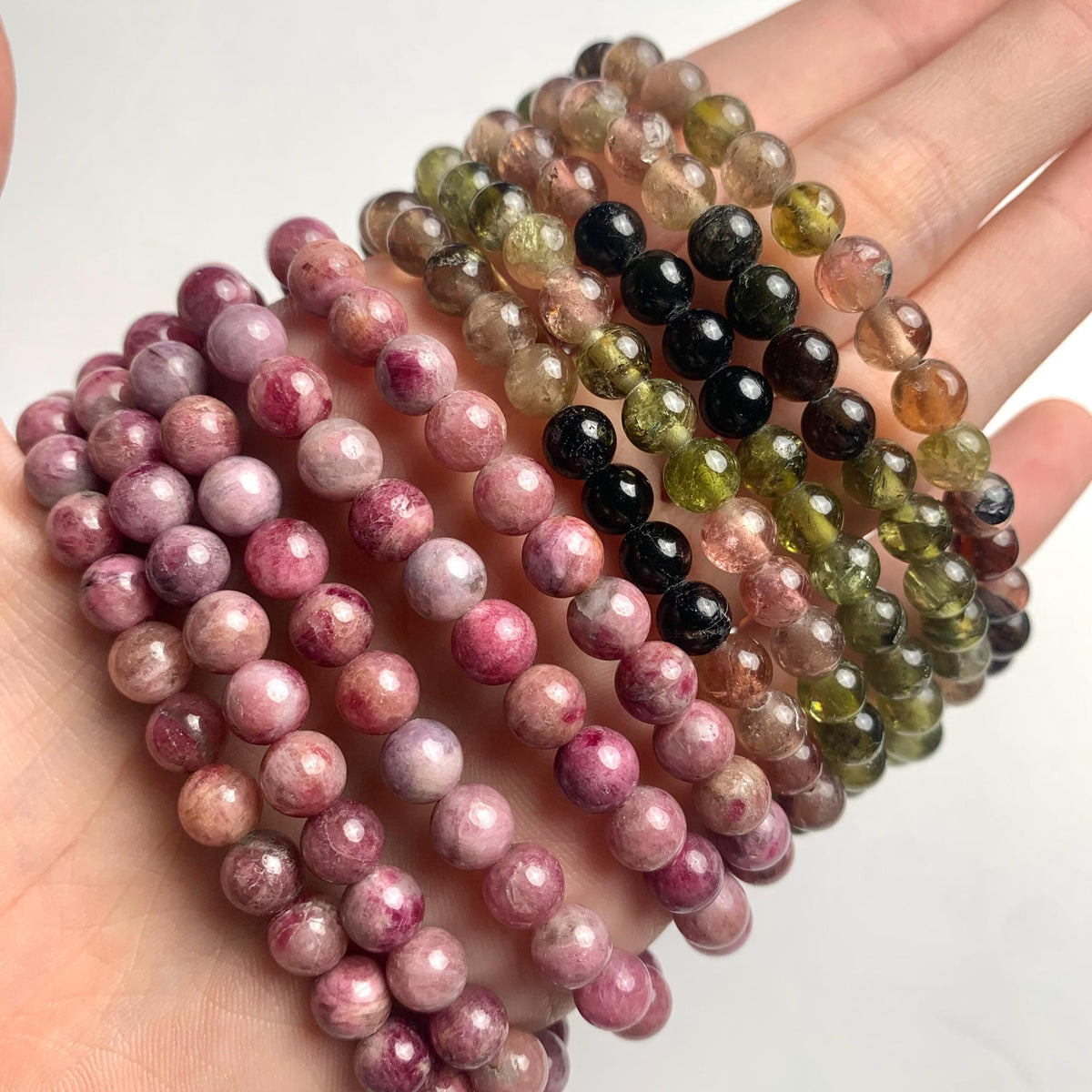 Men’s and women’s tourmaline bracelet styles with adjustable sizing options