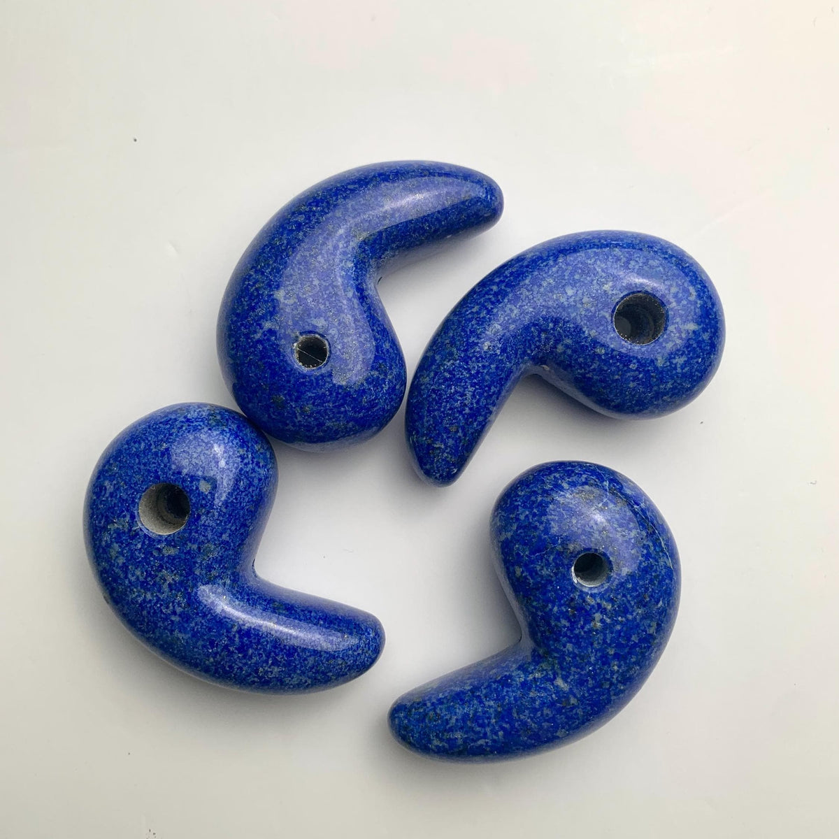 Traditional magatama-shaped Lapis Lazuli crystal pendant in deep blue.