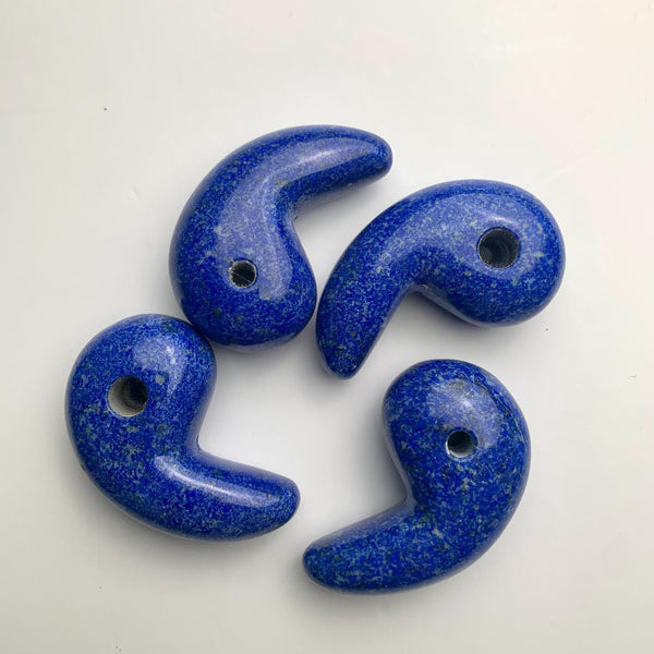 Traditional magatama-shaped Lapis Lazuli crystal pendant in deep blue.