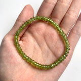 Peridot gemstone bracelet featuring smooth green rondelle beads