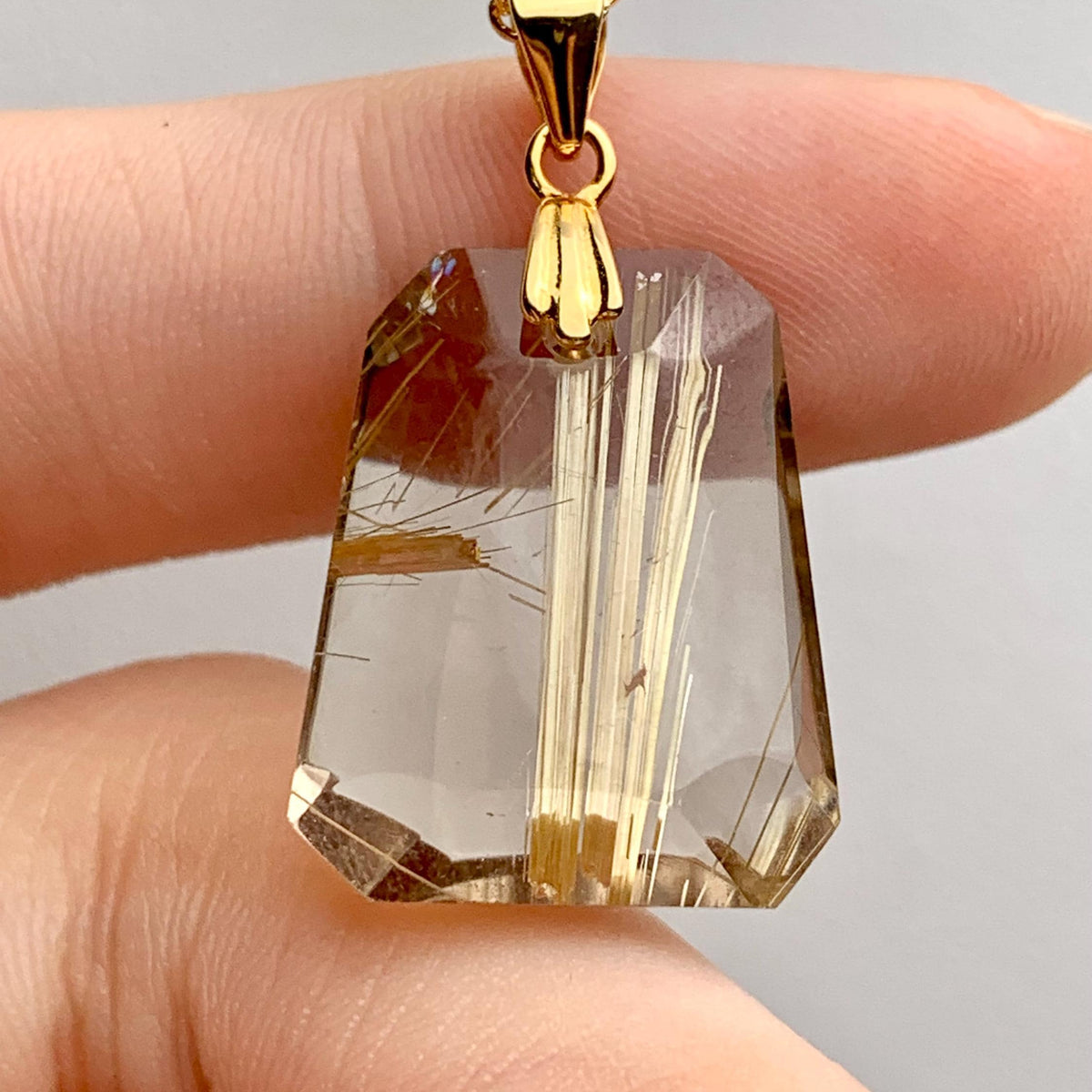 High clarity Rutilated Quartz crystal pendant in sterling silver setting