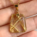 AAAA Rutilated Quartz pendant with brilliant golden rutile needle inclusions