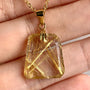 AAAA Rutilated Quartz pendant with brilliant golden rutile needle inclusions