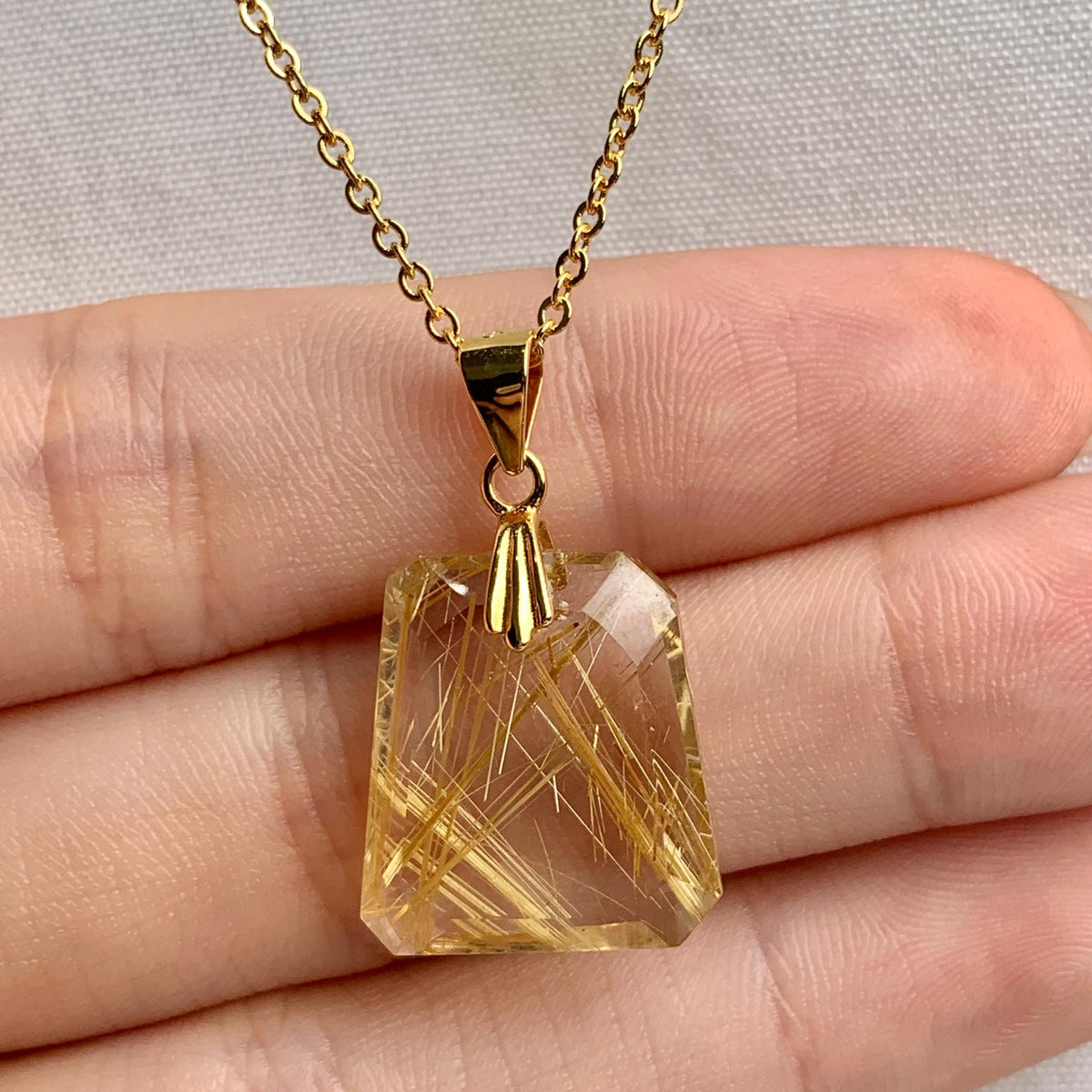 AAAA faceted Rutilated Quartz gemstone necklace with natural golden inclusions