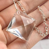 2.	Close-up of water-clear faceted quartz crystal 20mm wide showing pristine internal clarity and crisp gem facets.
