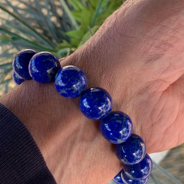 Elegant lapis bracelet showcasing rich blue polished oversized gemstone beads.