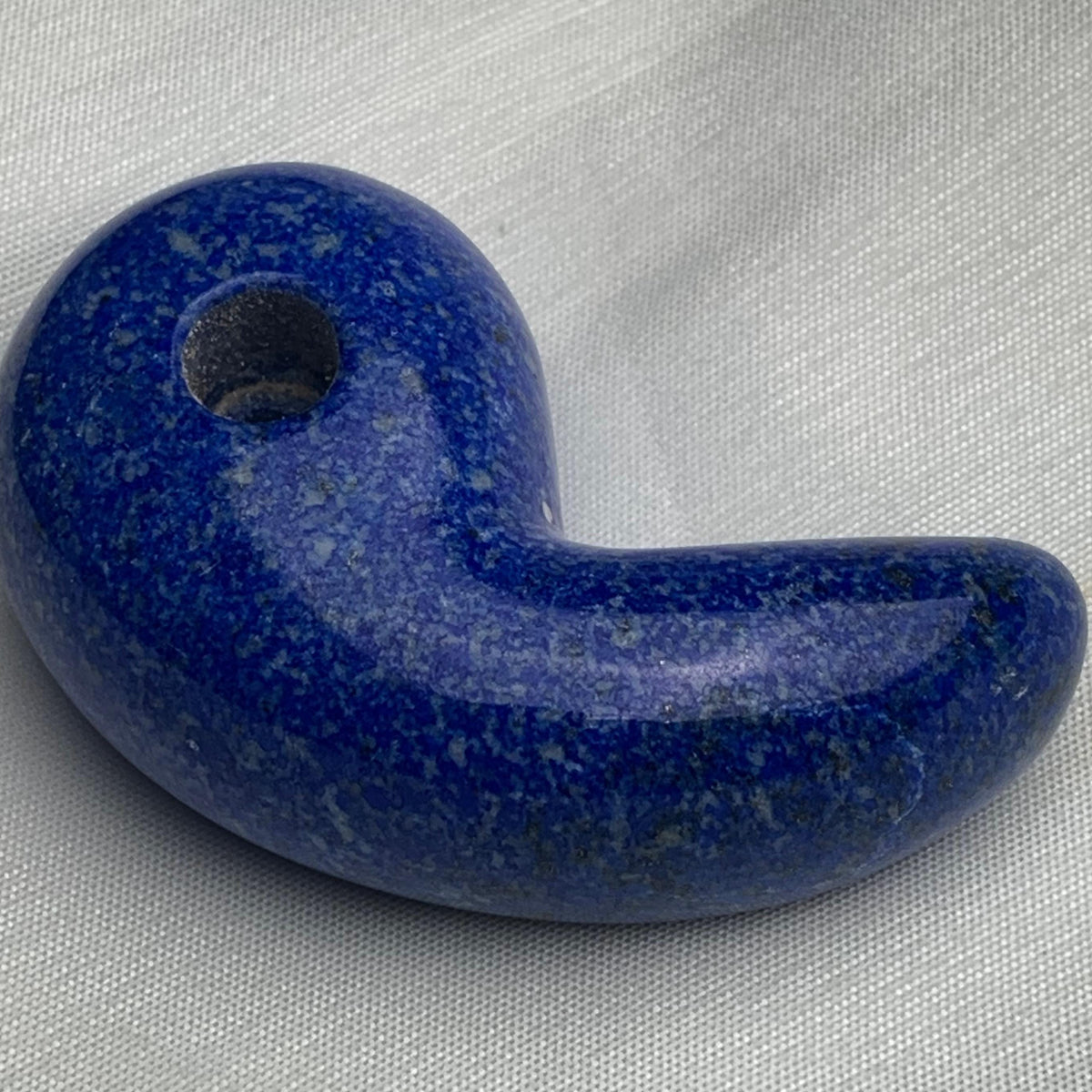 Traditional magatama-shaped Lapis Lazuli crystal pendant in deep blue.