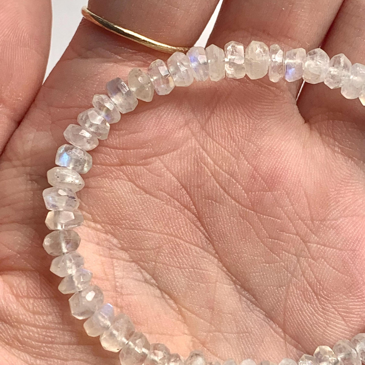 Blue and rainbow moonstone crystal bracelet with faceted rondelle beads