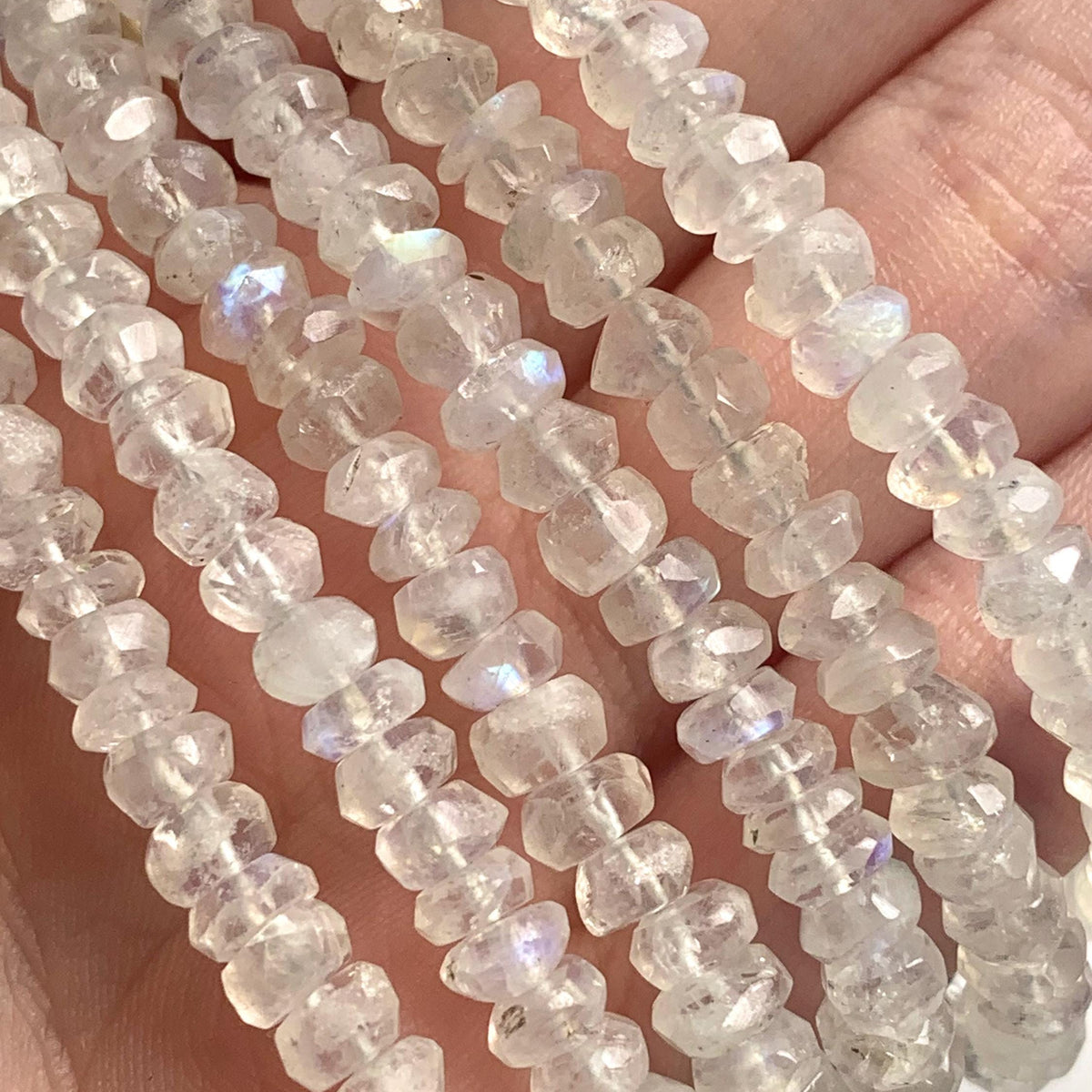 Rainbow moonstone jewelry featuring smooth-edged faceted rondelle beads