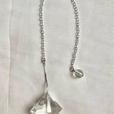 Compact faceted quartz pendulum for dowsing and crystal collections