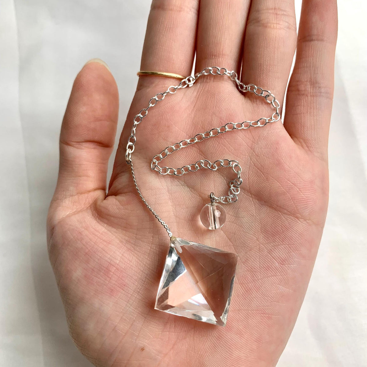Faceted clear quartz pendulum with 200mm chain for dowsing
