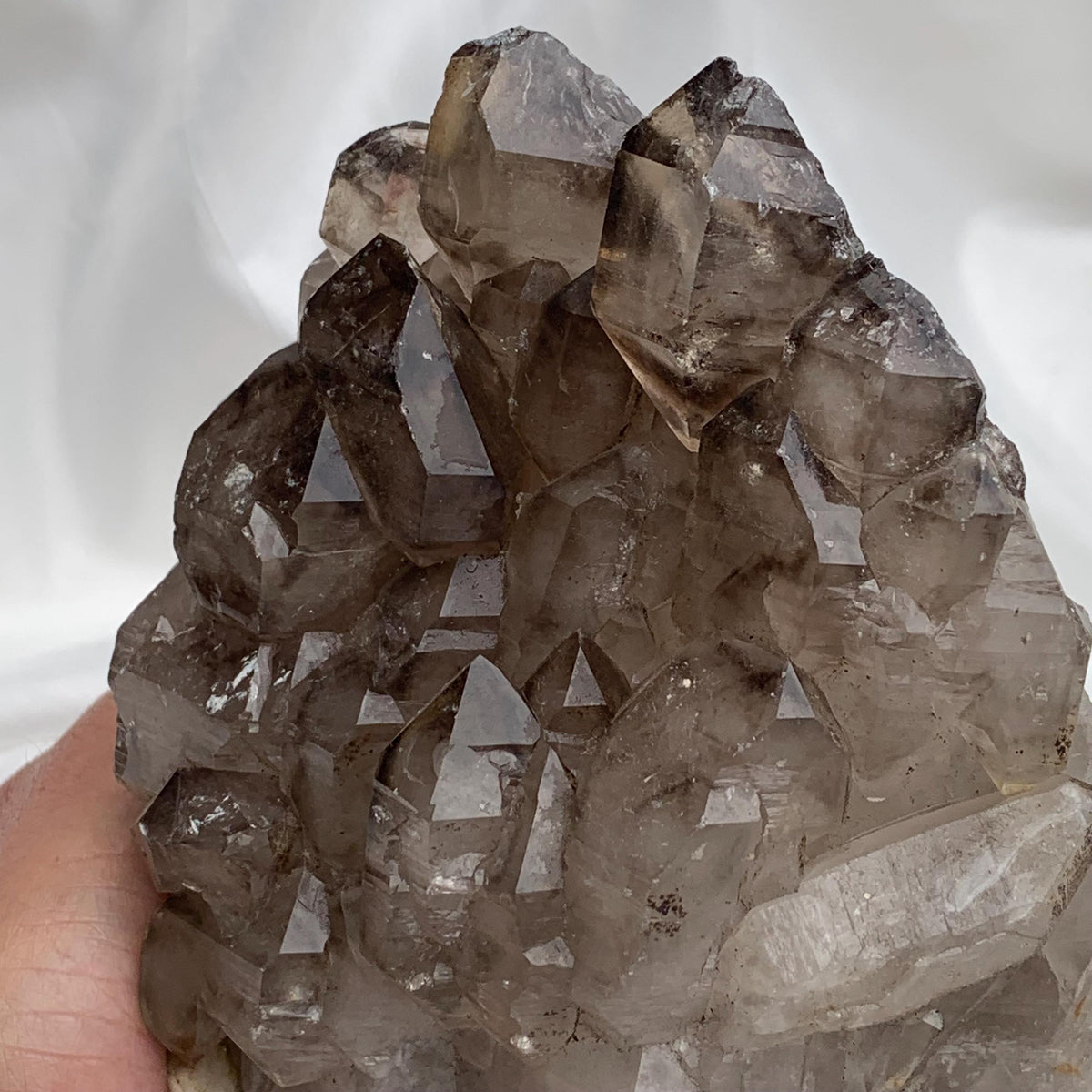 Three-quarter smoky quartz gwindel cluster view, gwindel quartz specimen showing stacked elestial layers and luster