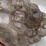 Upper side smoky quartz gwindel cluster, elestial quartz cluster features and smoky brown internal banding visible