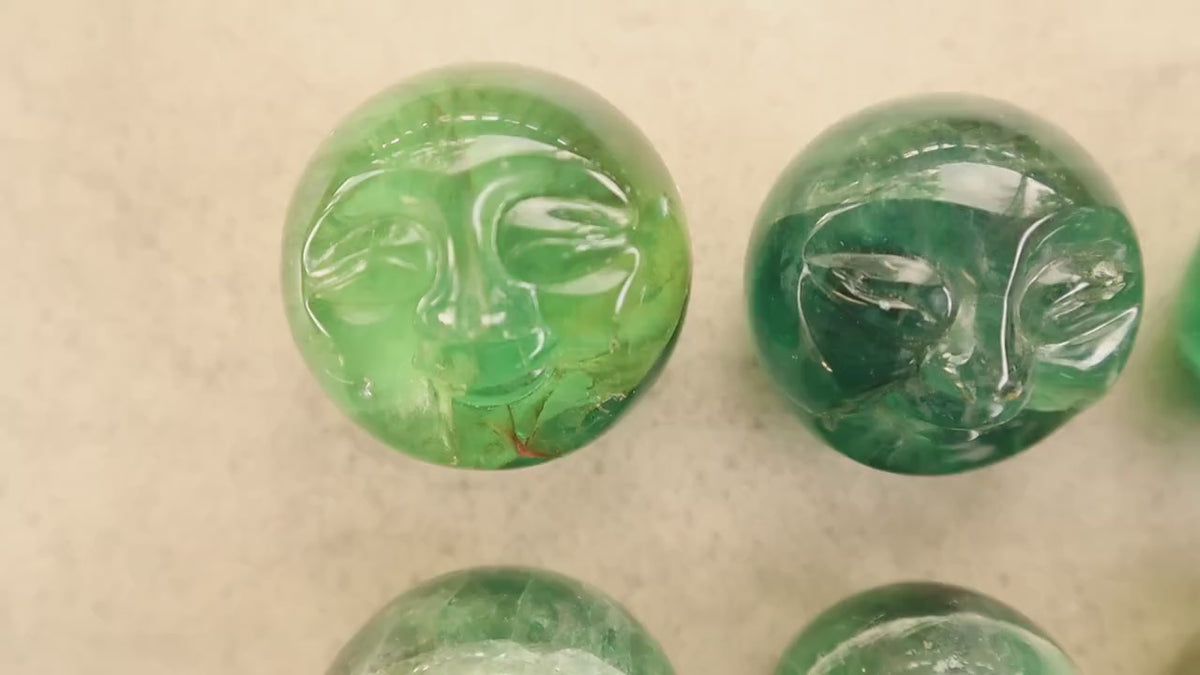 Fluorite Moon Face Sphere: Carved Crystal Orb for Lunar Rituals
