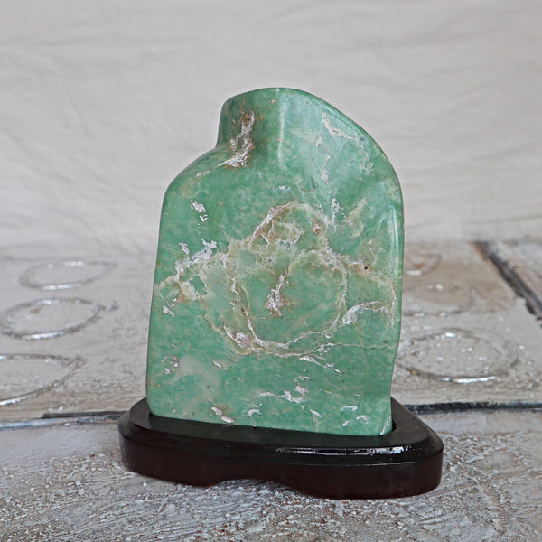 Large Nephrite Jade Stone free form on wooden stand for Abundance Lucky Stone